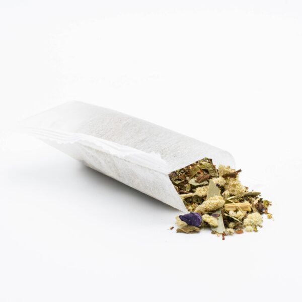 An opened tea bag of Breathe Well - Hemp Tea by The Brothers Apothecary, on a white background