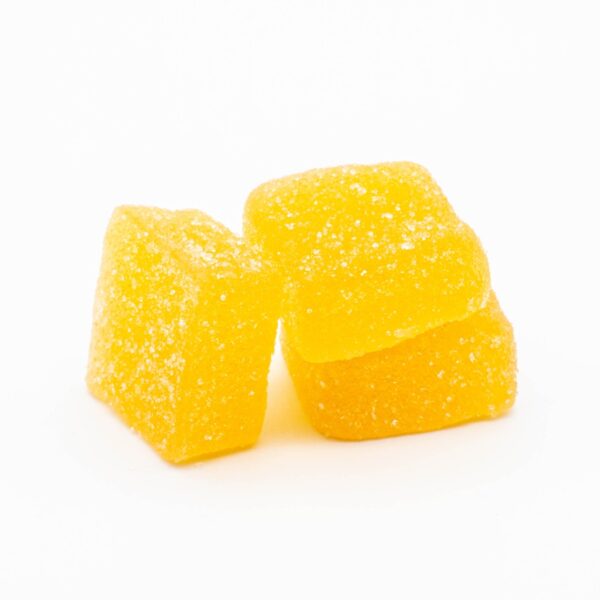 A small pile of Cycling Frog 5:1 Mango Pineapple Gummies, on a white background.