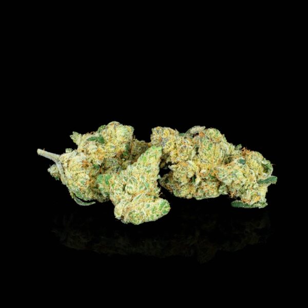 A small pile of Flow Gardens Blueberry Cough Drops hemp flower, on a black background