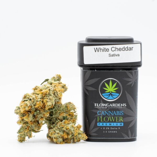 A small pile of Flow Gardens White Cheddar CBG hemp flower, next to a 3.5g container, on a white background