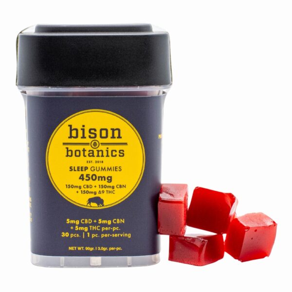 A container of Bison Botanics 1:1 Sleep Gummies, next to a small pile of the gummies, on a clear background