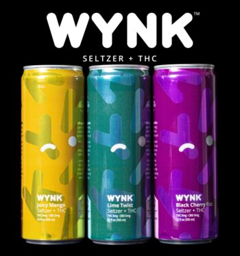 Three cans of WYNK Infused Seltzers, with one Juicy Mango, one Lime Twist, and one Black Cherry Fizz, on a black background