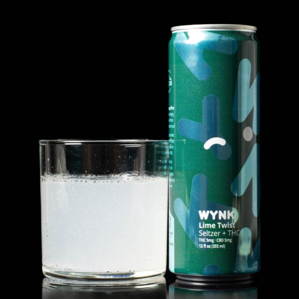 A single can of Lime Twist flavored WYNK Infused Seltzers, next to a clear glass container containing the drink, on a black background