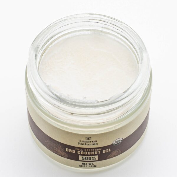 One jar of Lazarus Naturals CBD Coconut Oil, with its lid removed to show the coconut oil, on a white background.