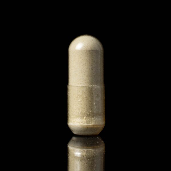 One capsule of Plant Science Laboratories Capsules- CBD, on a black background
