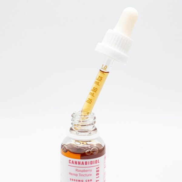 A 1mL dropper of Extract Labs Raspberry CBD Oil, on a white background