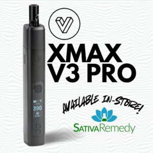 A xmax v3 pro vaporizer standing by itself with words saying, "Available in Store" with the Sativa Remdy logo