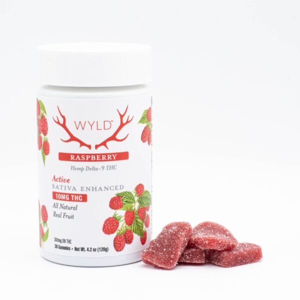 A 30-count bottle of Wyld THC Raspberry Gummies, next to a small pile of the gummies, on a white background.